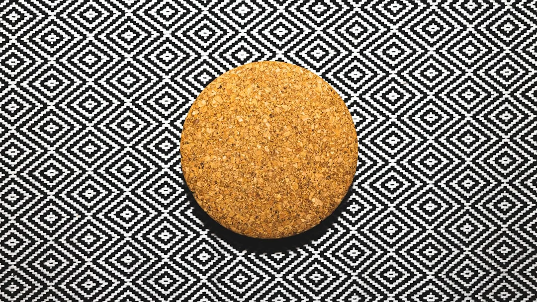 round brown round food on black and white textile